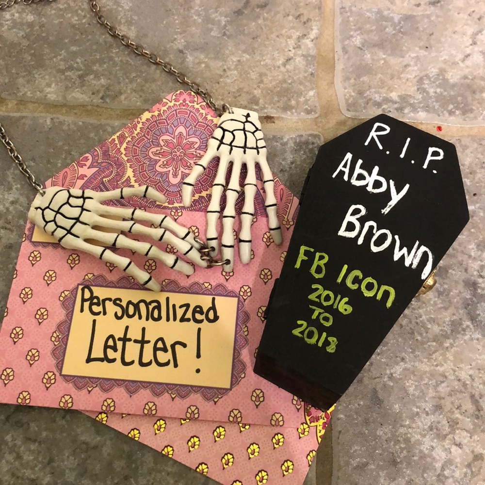 Skeleton hand necklace and coffin box